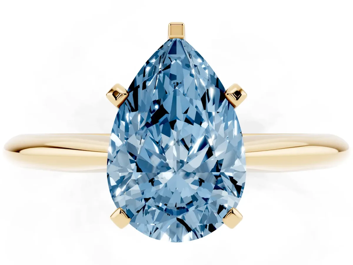 Fancy Blue Pear Cut Cut Solitaire Ring with Four-Prong Setting on a Classic Band Yellow gold