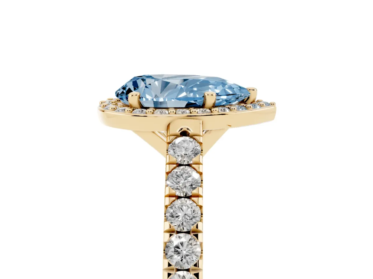 Fancy Blue Pear Cut Cut Halo Diamond Engagement Ring with Pave Band and Four-Prong Setting Yellow gold