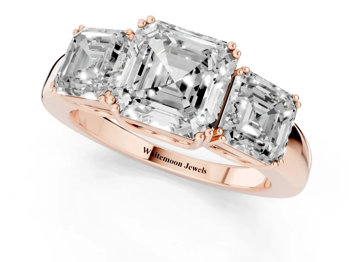Three-Stone Asscher Cut Cut Diamond Ring with Channel Set Band and Four-Prong Setting Rose gold