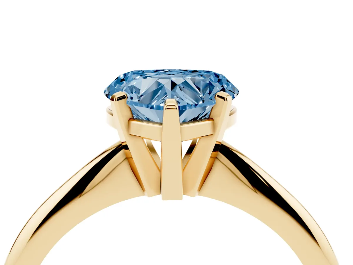 Fancy Blue Heart Cut Cut Solitaire Ring with Four-Prong Setting on a Classic Band Yellow gold