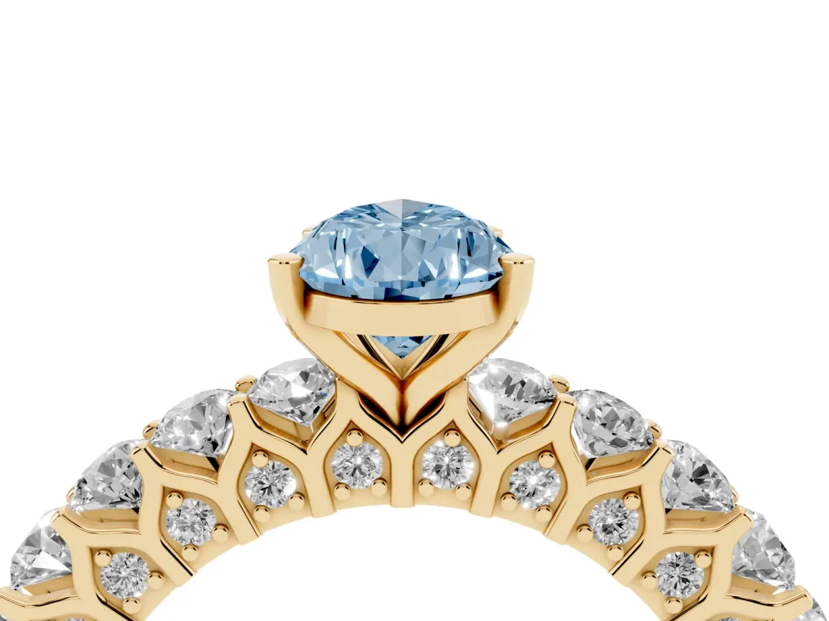 Fancy Blue Pear Cut Diamond Solitaire Ring with Shared Prong Pavé Band and Four-Prong Setting Yellow gold