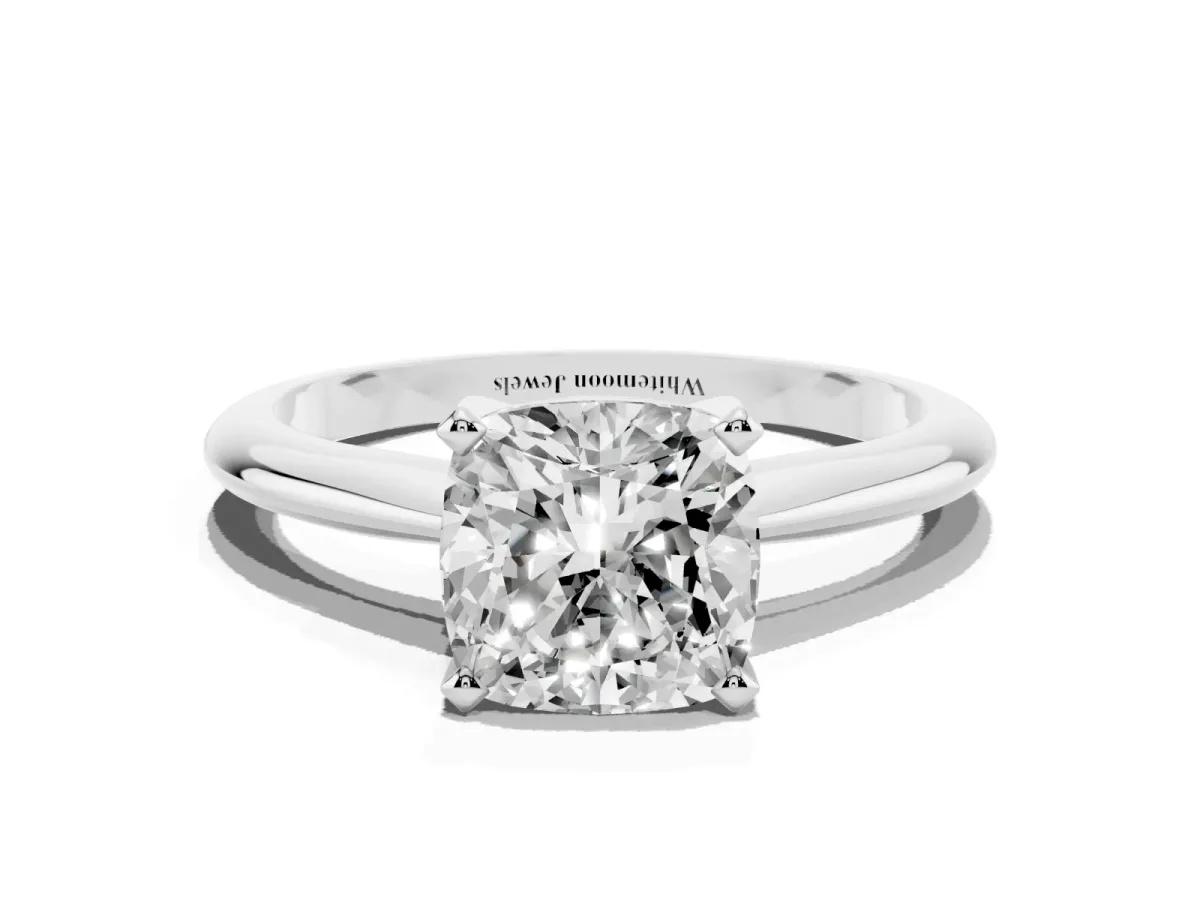 Cushion Cut Cut Solitaire Ring with Four-Prong Setting on a Classic Band Silver