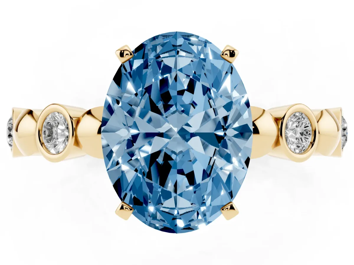 Fancy Blue Oval Cut Solitaire Bezel-Set Diamond Ring with Beaded Band and Four-Prong Setting Yellow gold
