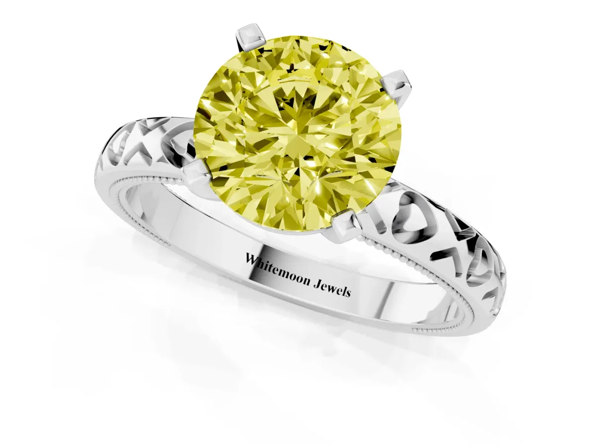 Fancy Yellow Round Cut Solitaire Diamond Engagement Ring with XO Engraved Band and Four-Prong Setting Silver