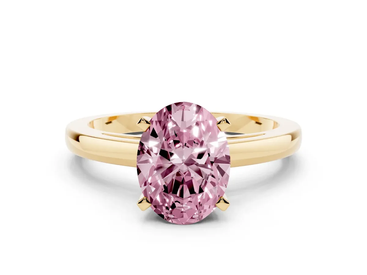 Fancy Pink Oval Cut Solitaire Diamond Engagement Ring with Four-Prong Setting on a Classic Band Yellow gold
