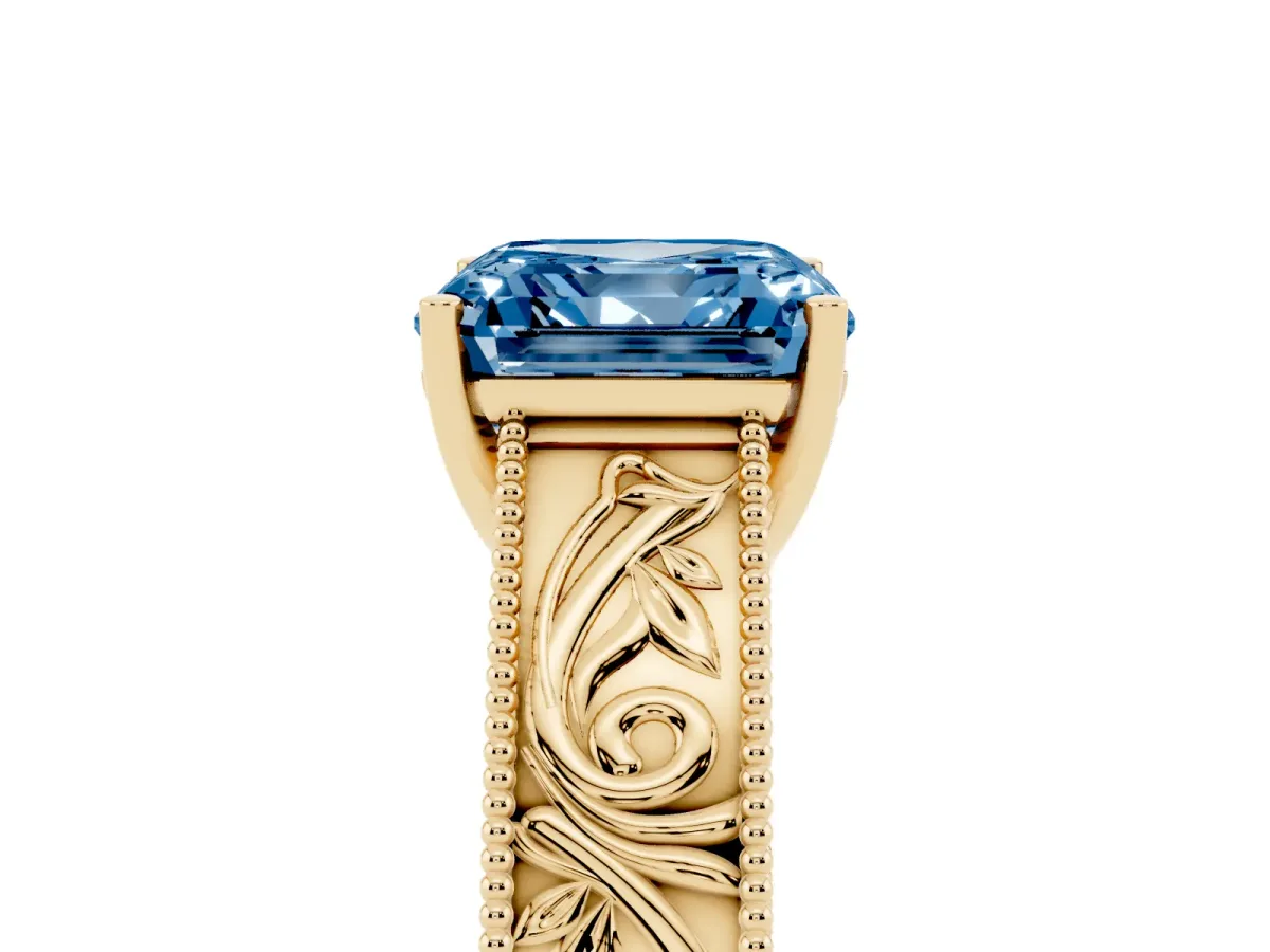 Fancy Blue Asscher Cut Diamond Solitaire Ring with Engraved Band and Four-Prong Setting Yellow gold