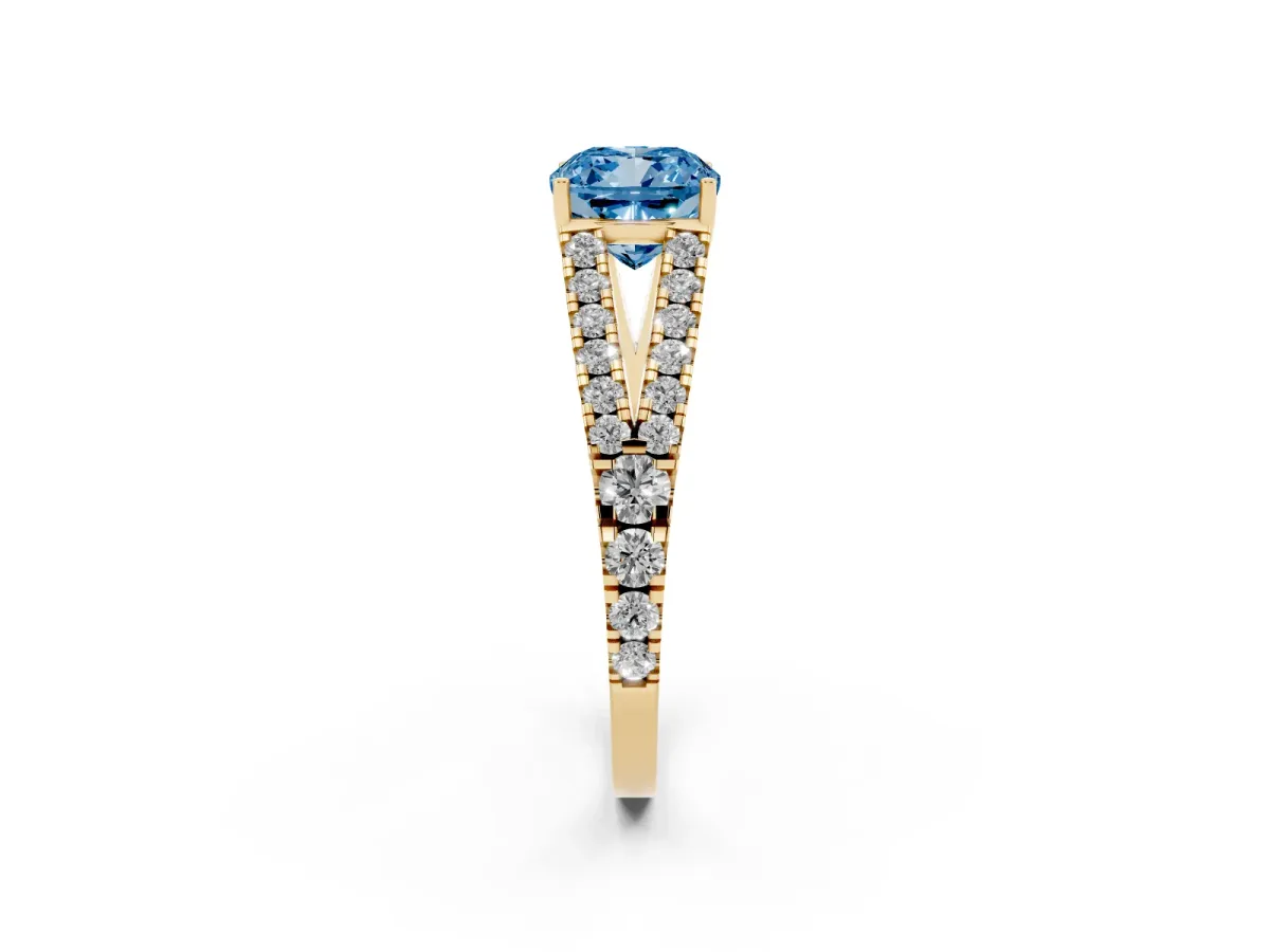 Fancy Blue Cushion Cut Diamond Split Shank Engagement Ring with Round Pavé and Prong Setting Yellow gold