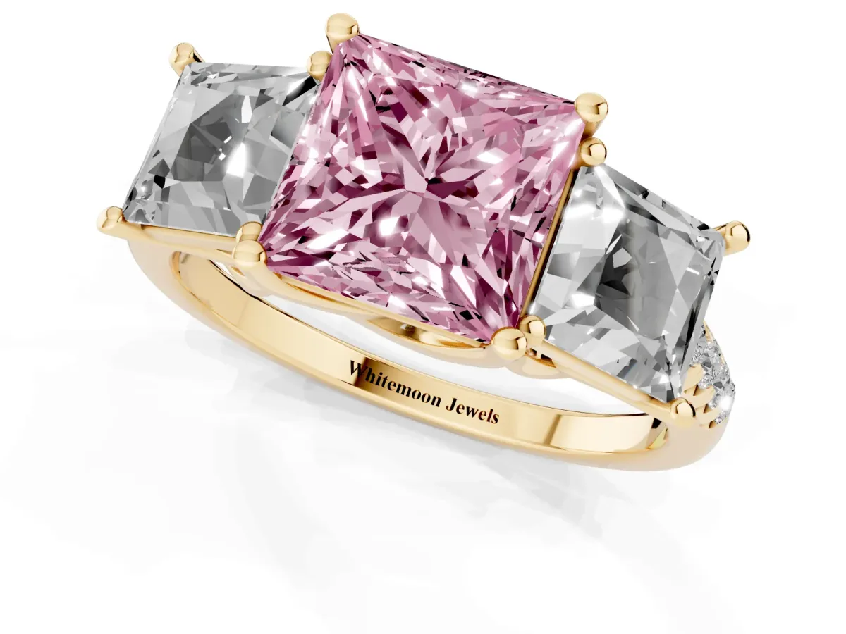 Fancy Pink Three-Stone Princess Cut Diamond Ring with Round Pavé Band and Prong Setting Yellow gold