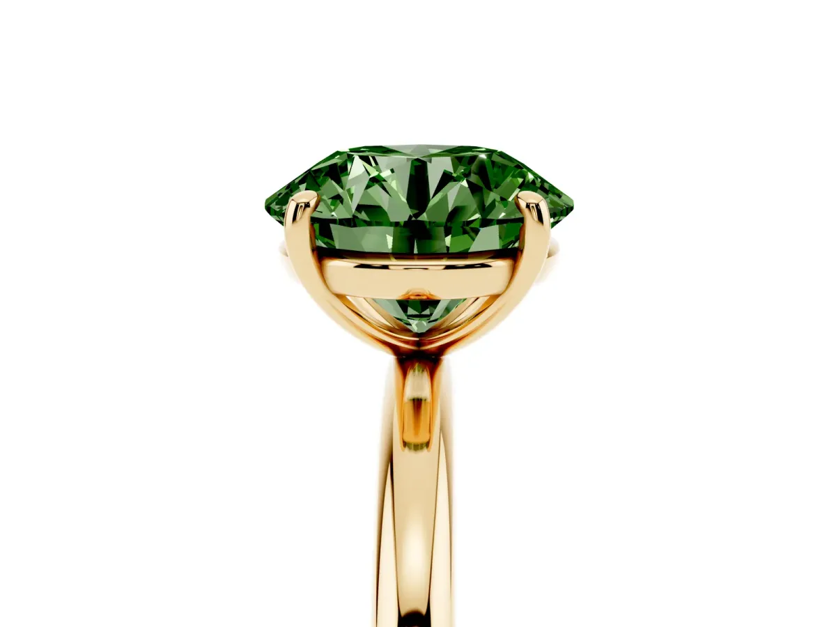 Fancy Green Round Cut Solitaire Diamond Ring with Four-Prong Setting on a Plain Band Yellow gold