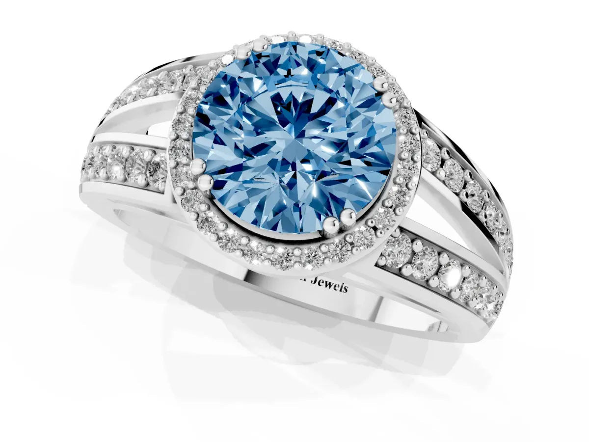 Fancy Blue Round Cut Diamond Halo Ring with Split Shank Pavé Band and Four-Prong Setting Silver