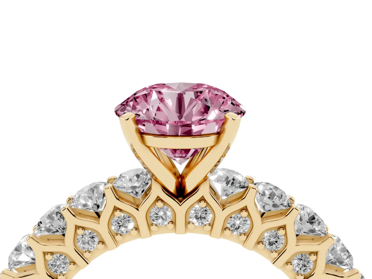 Fancy Pink Round Cut Diamond Solitaire Ring with Shared Prong Pavé Band and Four-Prong Setting Yellow gold