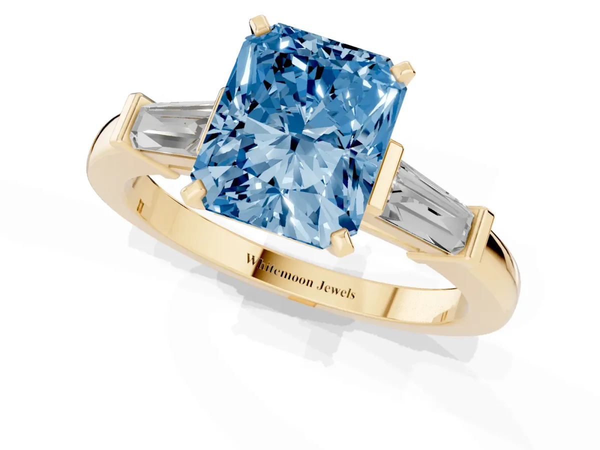 Fancy Blue Radiant Cut Cut Diamond Solitaire Ring with Tapered Baguette Accents and Four-Prong Setting Yellow gold