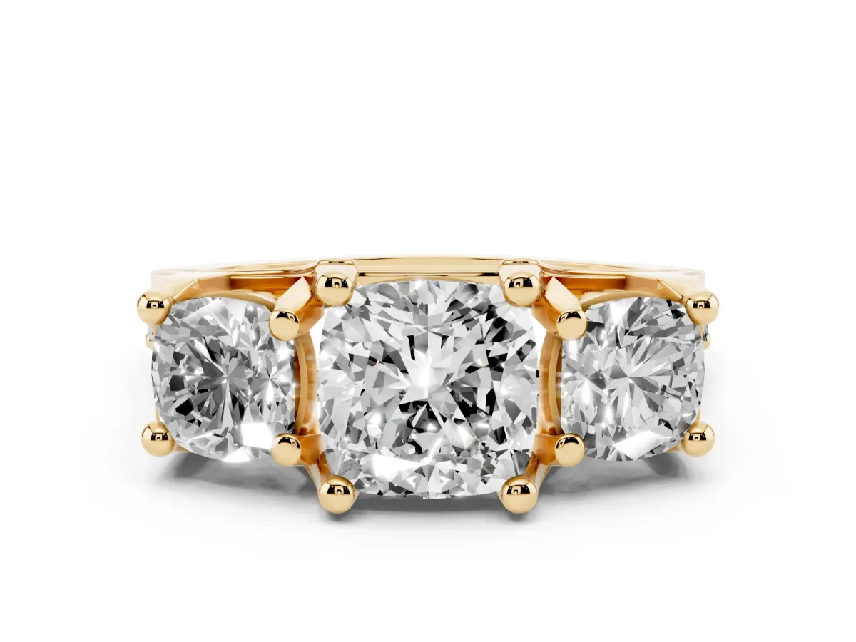 Cushion Cut Diamond Three-Stone Ring with Channel Set Band and Four-Prong Setting Yellow gold