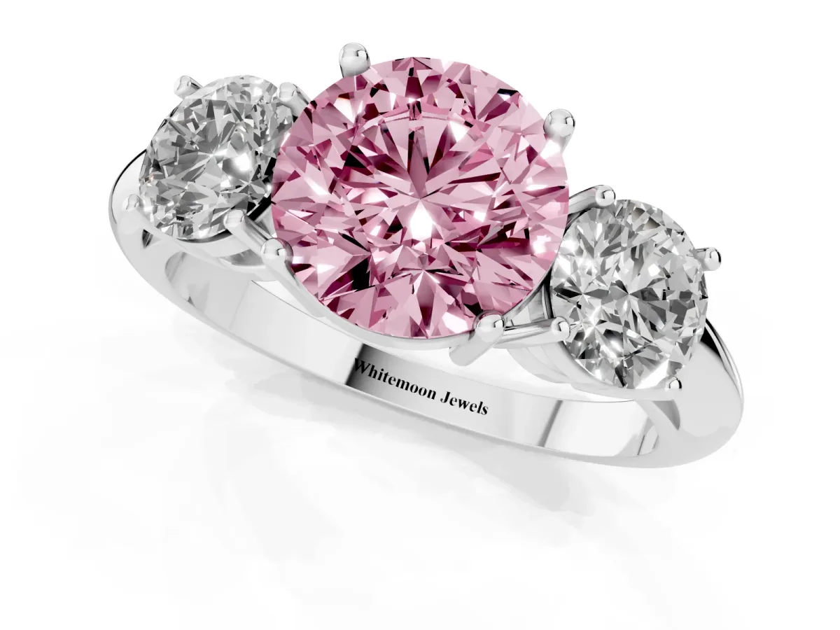 Fancy Pink Three-Stone Round Cut Cut Diamond Engagement Ring with Prong Setting on a White Gold Band Silver
