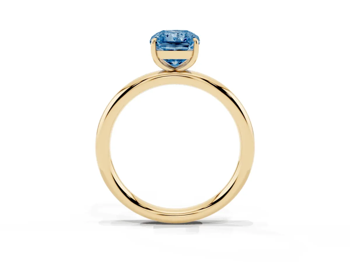 Fancy Blue Radiant Cut Solitaire Diamond Ring with Four-Prong Setting on a Plain Band Yellow gold