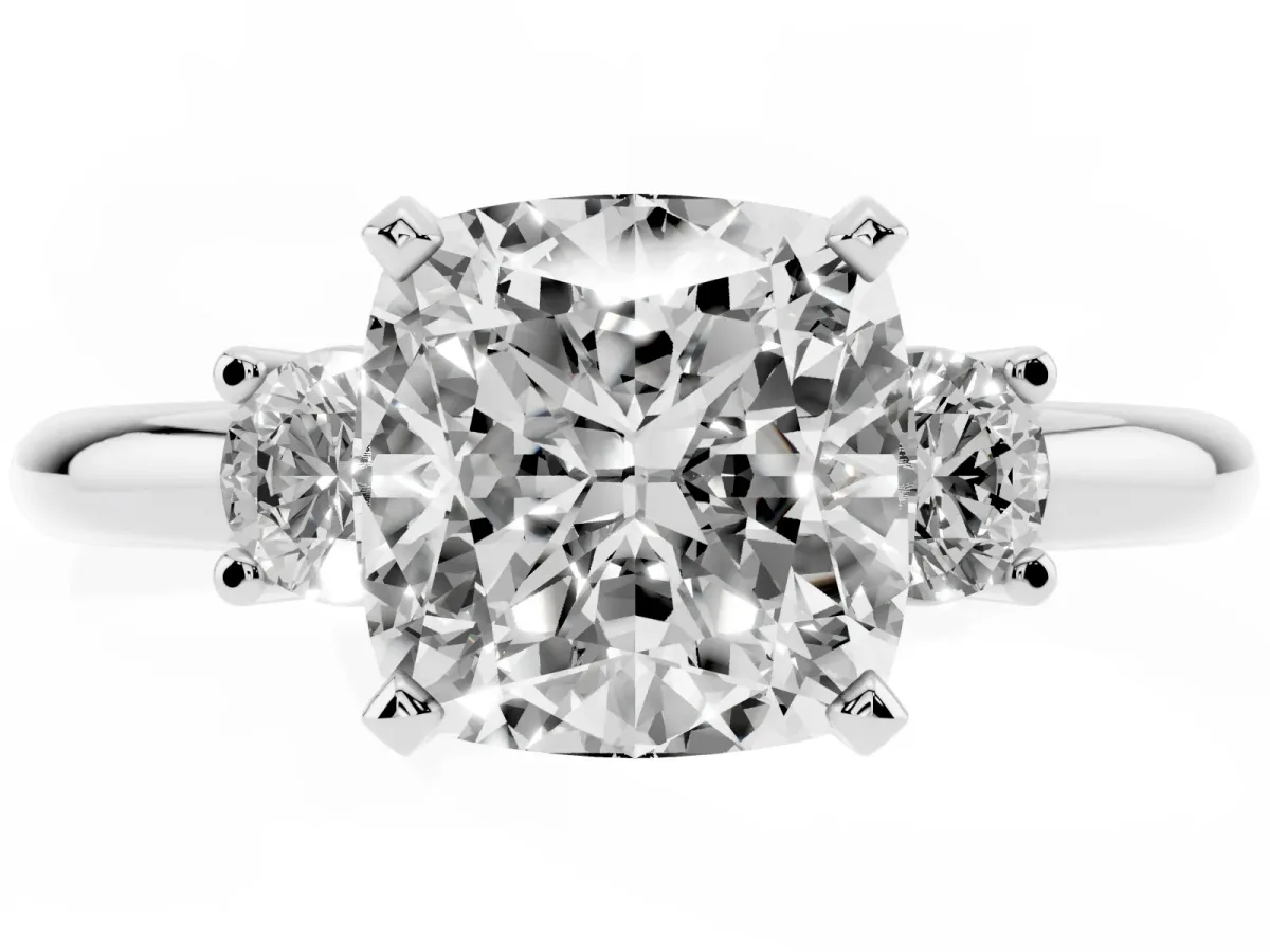 Three-Stone Cushion Cut Cut Diamond Solitaire with Prong Setting and Classic Band Platinum