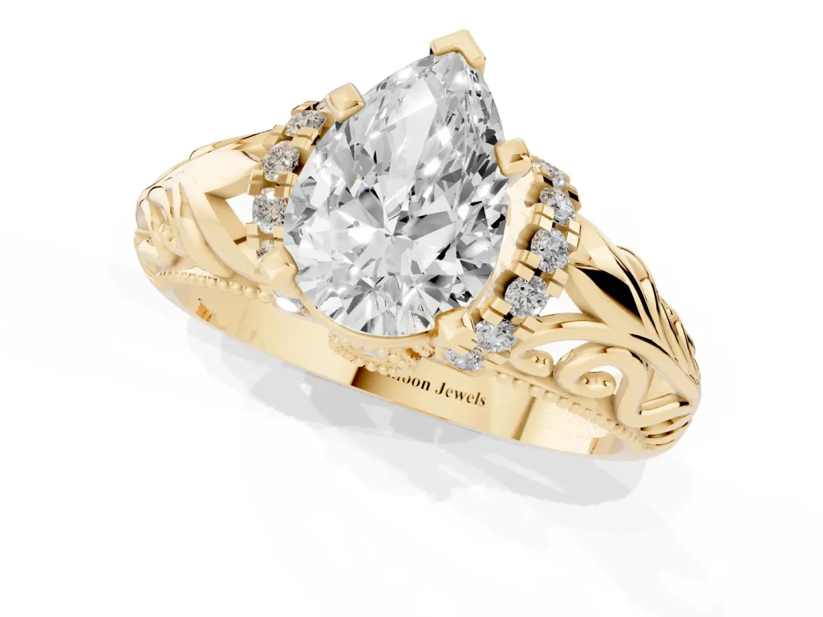 Pear Cut Solitaire Filigree Engagement Ring with Halo and Prong Setting Yellow gold