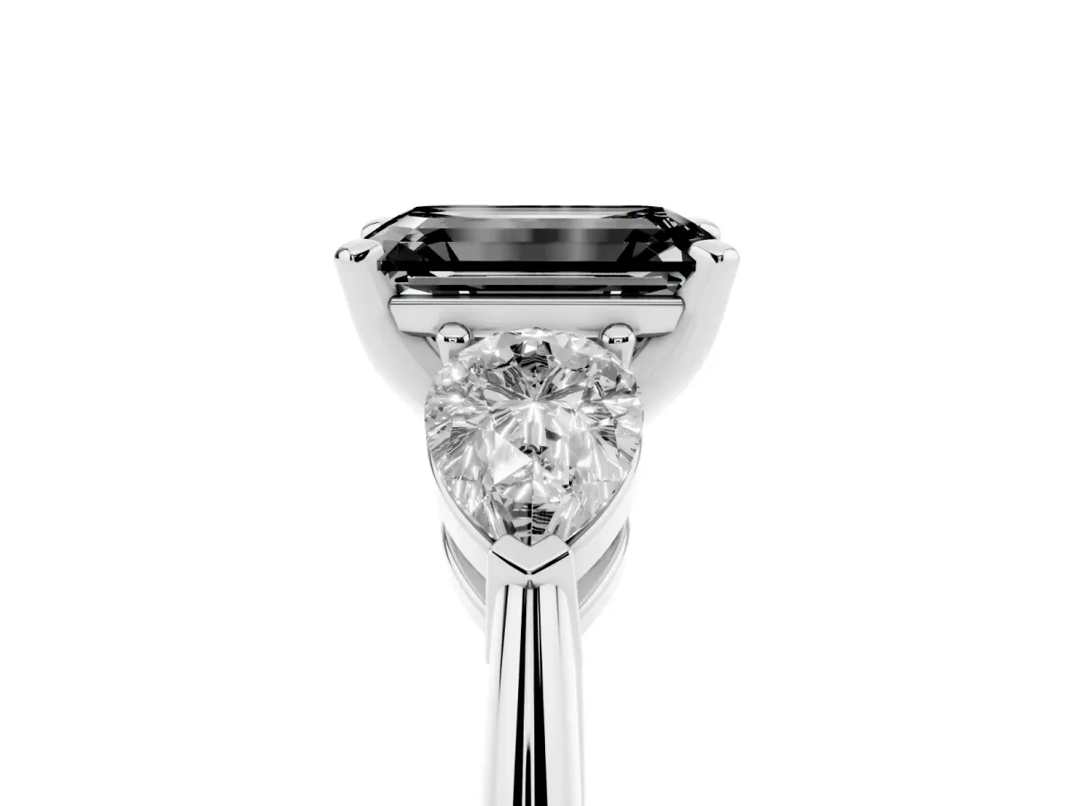 Fancy Black Three-Stone Emerald Cut Diamond Ring with Pear Side Stones and Four-Prong Setting Platinum