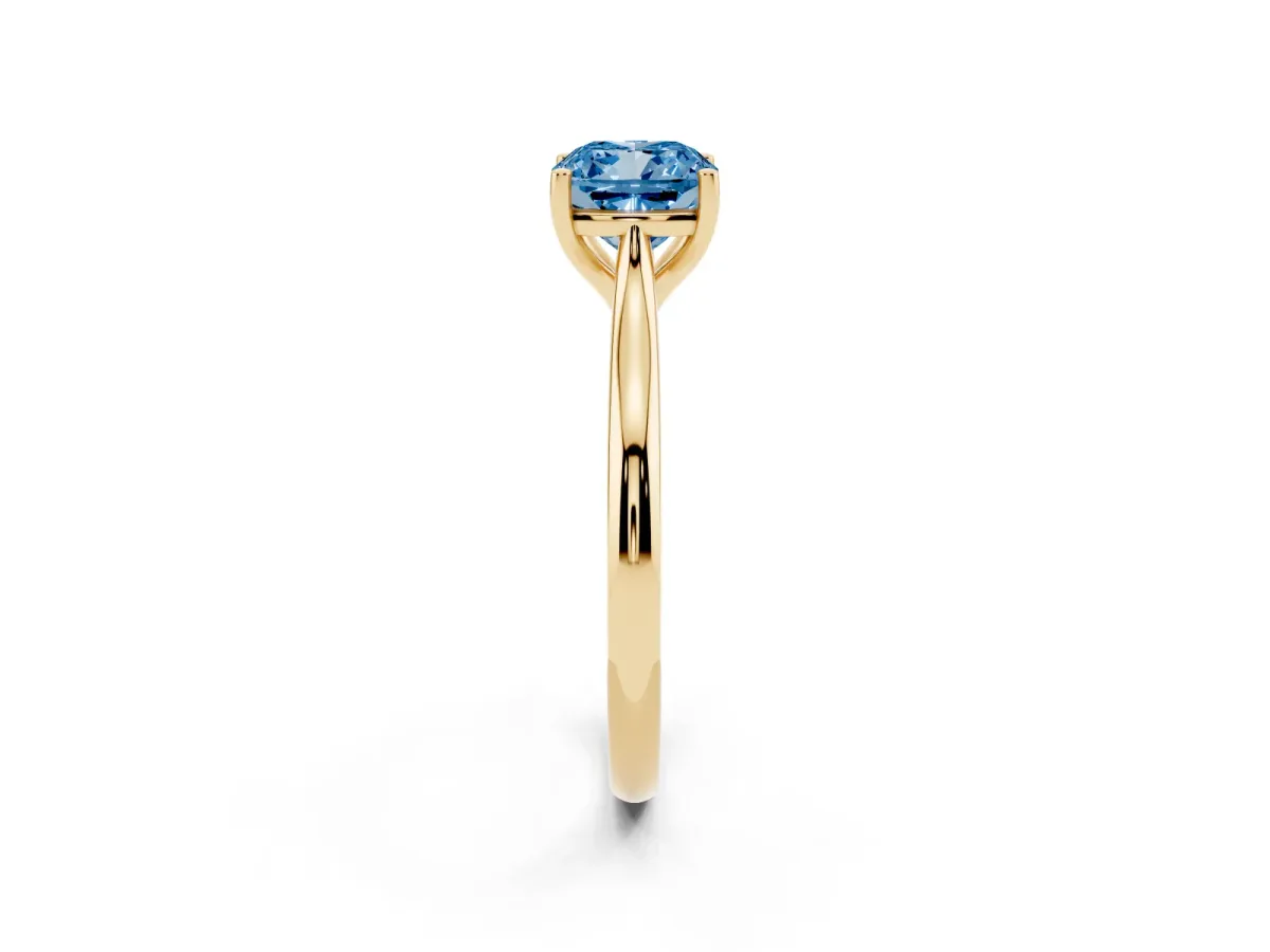 Fancy Blue Cushion Cut Cut Solitaire Ring with Cathedral Band and Four-Prong Setting Yellow gold