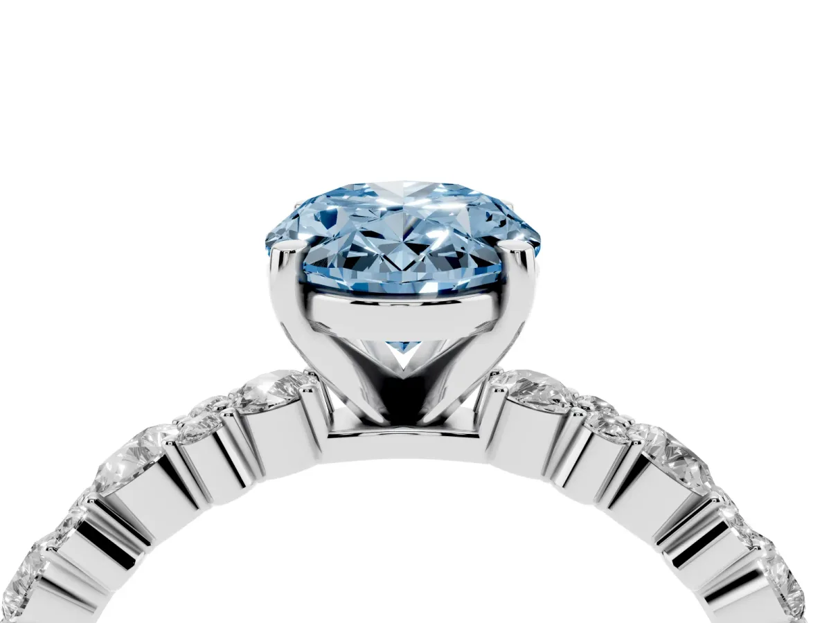 Fancy Blue Oval Cut Diamond Side Stone Solitaire Ring with Round and Four-Prong Setting Silver