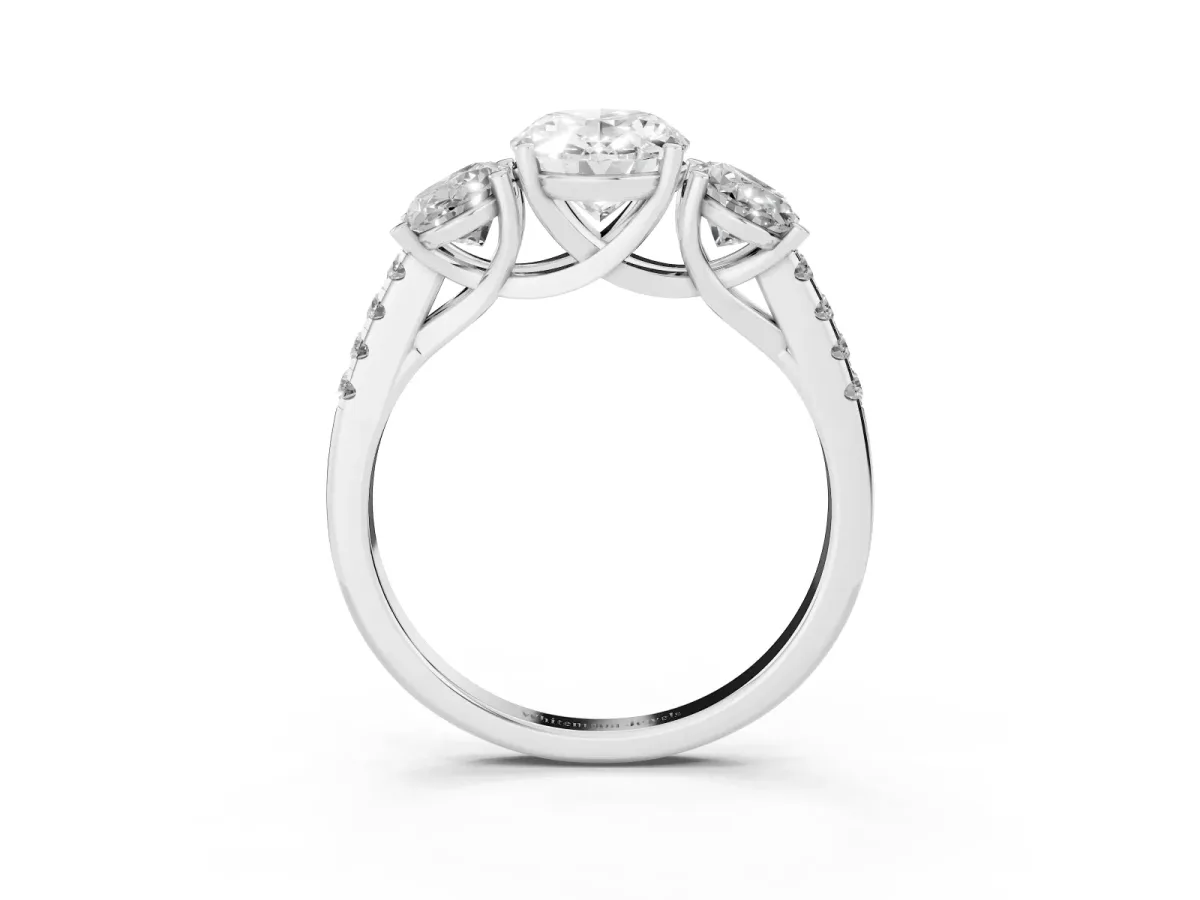 Three-Stone Oval Cut Diamond Ring with Round Pavé Band and Prong Setting Platinum
