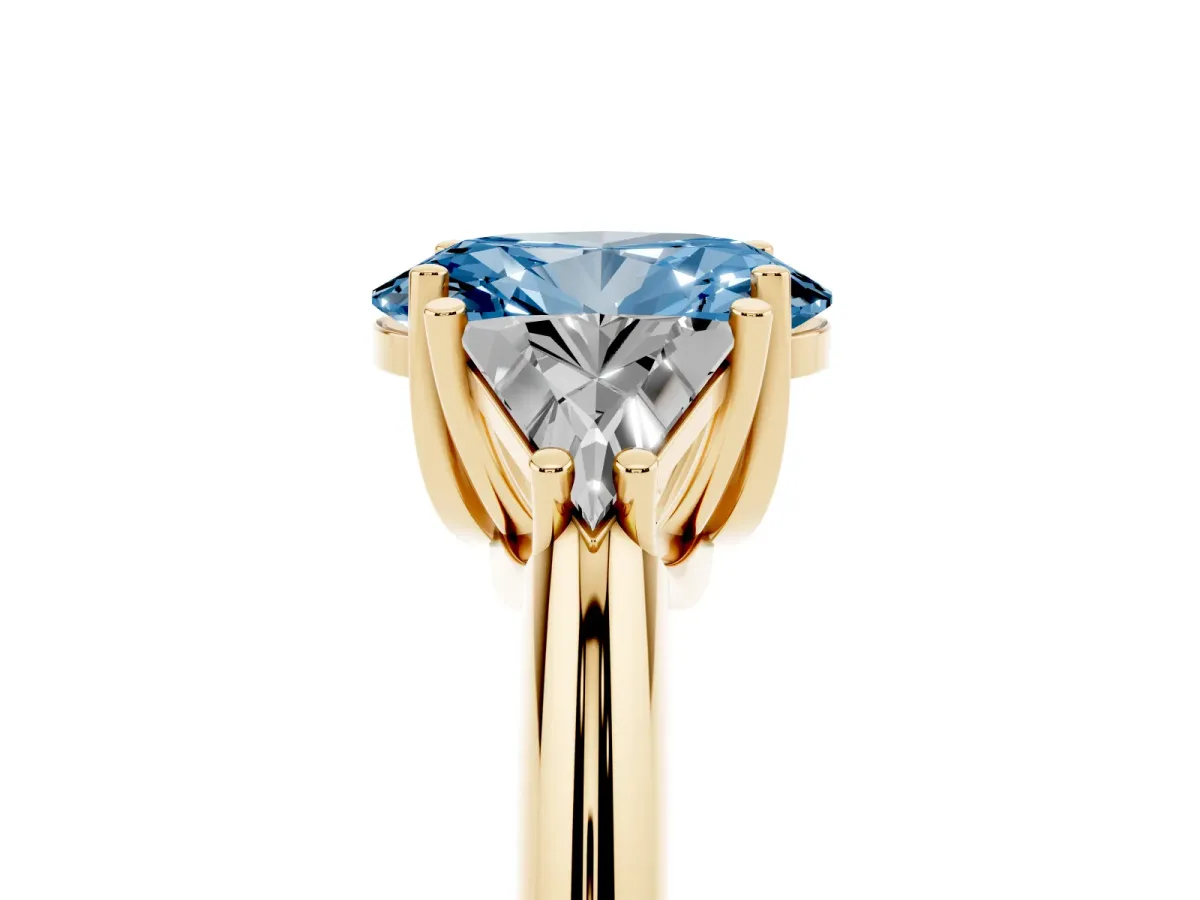 Fancy Blue Three-Stone Oval Cut Diamond Engagement Ring with Trillion Side Stones and Prong Setting Yellow gold