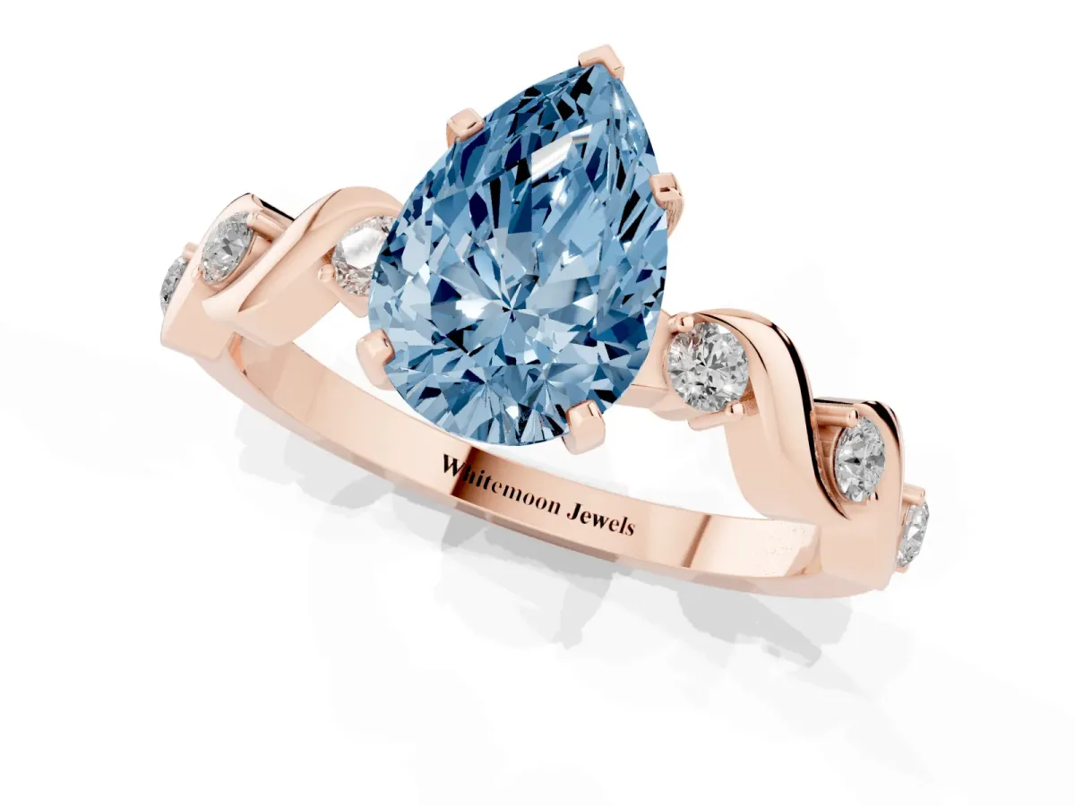 Fancy Blue Pear Cut Diamond Solitaire Twisted Band with Round Accents and Prong Setting Rose gold