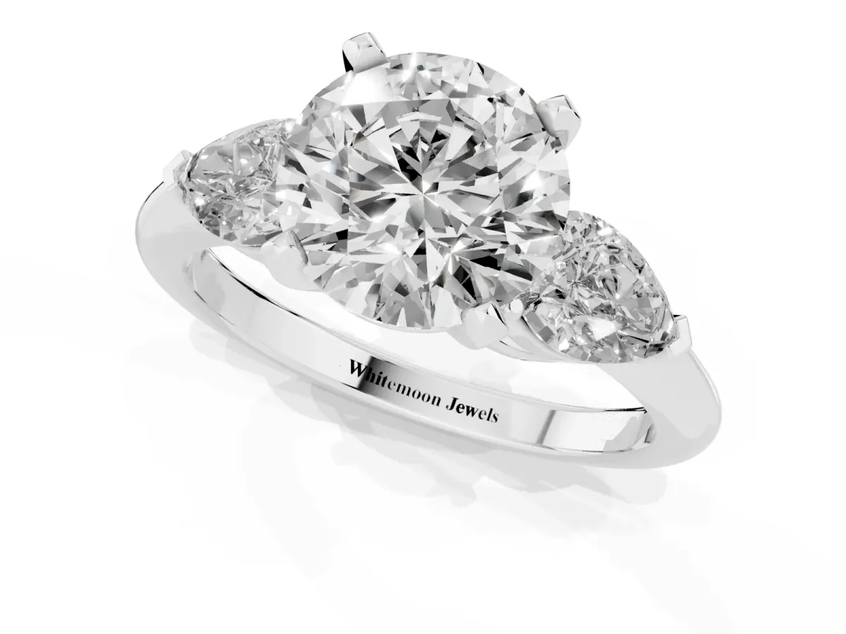 Three-Stone Round Cut Diamond Ring with Pear Side Stones and Four-Prong Setting Silver