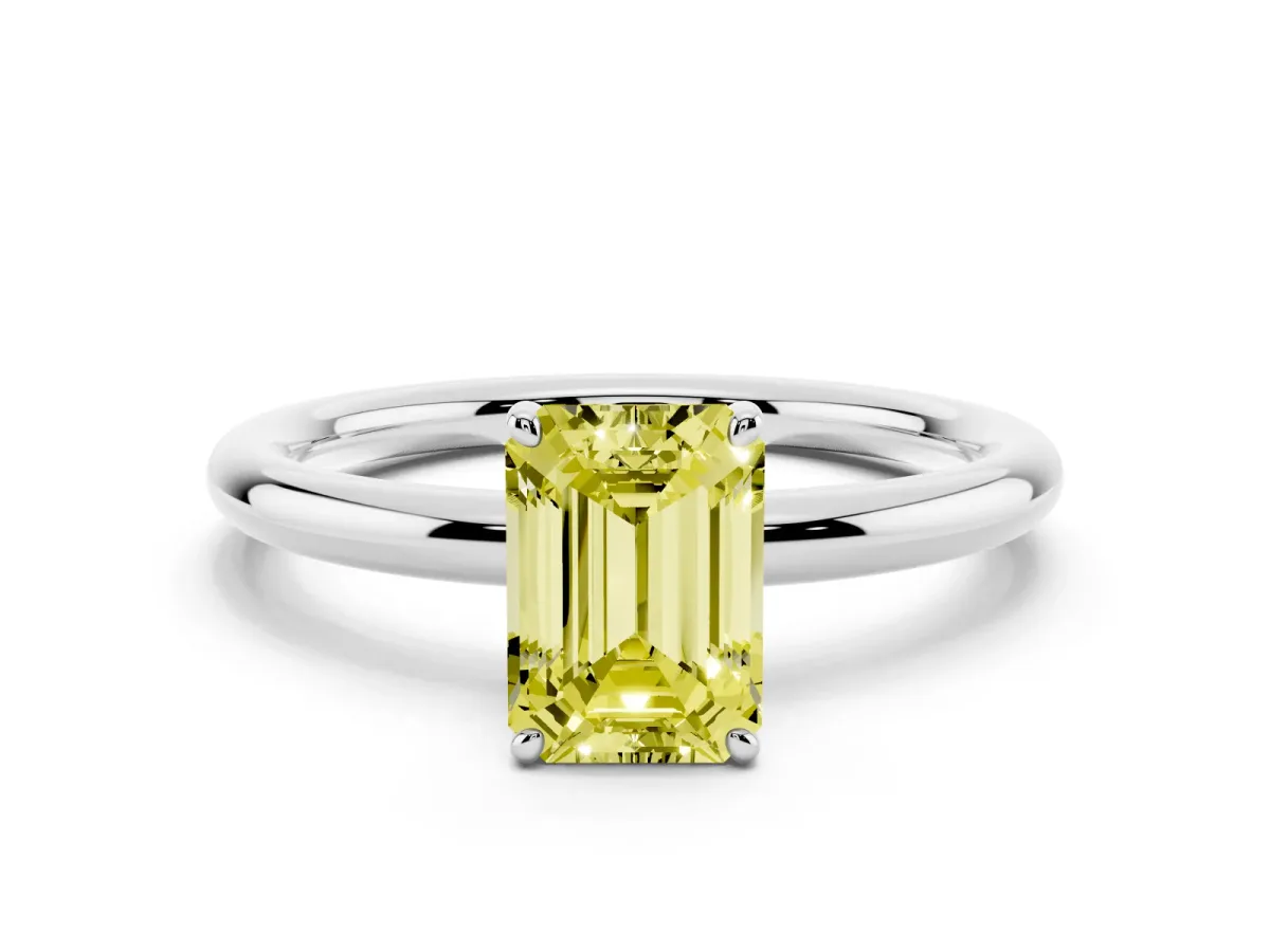 Fancy Yellow Emerald Cut Solitaire Diamond Ring with Four-Prong Setting on a Plain Band Platinum