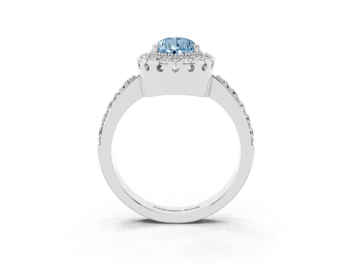 Fancy Blue Pear Cut Diamond Halo Ring with Pavé Band and Prong Setting Platinum