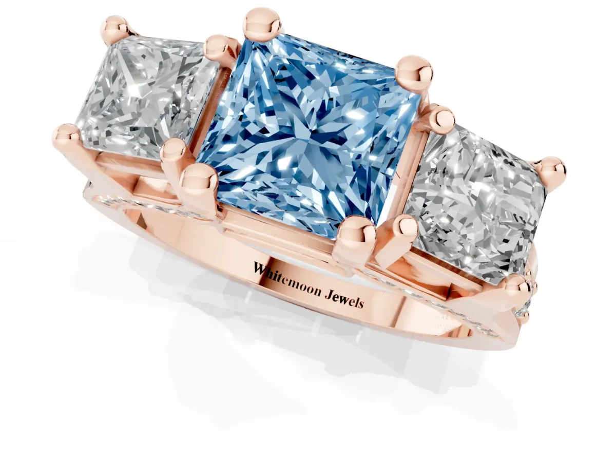 Fancy Blue Princess Cut Diamond Three-Stone Ring with Channel Set Band and Four-Prong Setting Rose gold