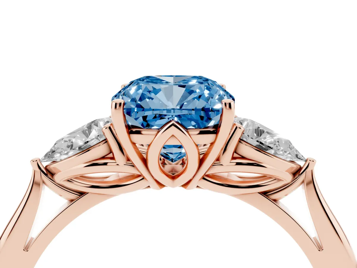 Fancy Blue Three-Stone Cushion Cut Diamond Ring with Pear Side Stones in Four-Prong Setting Rose gold