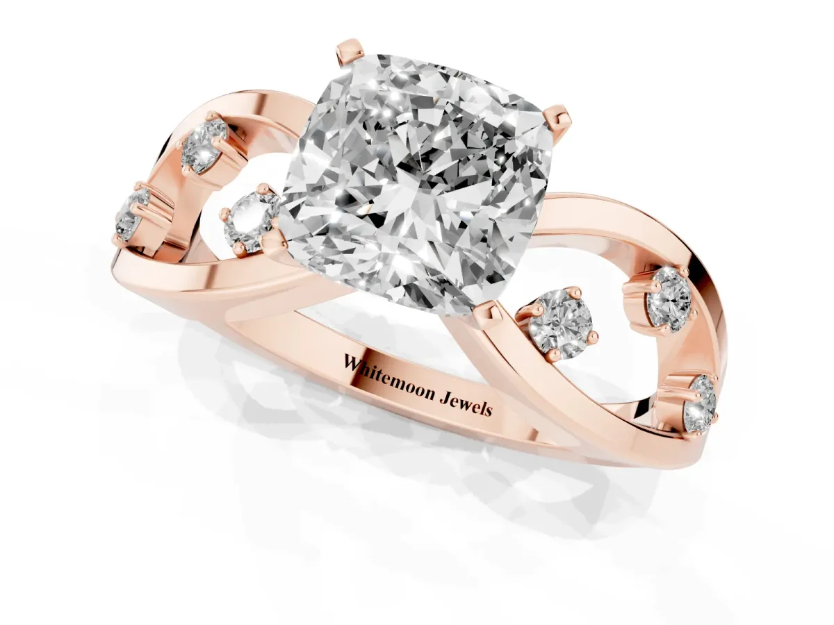 Cushion Cut Cut Solitaire Diamond with Side Stones on Criss-Cross Band and Four-Prong Setting Rose gold