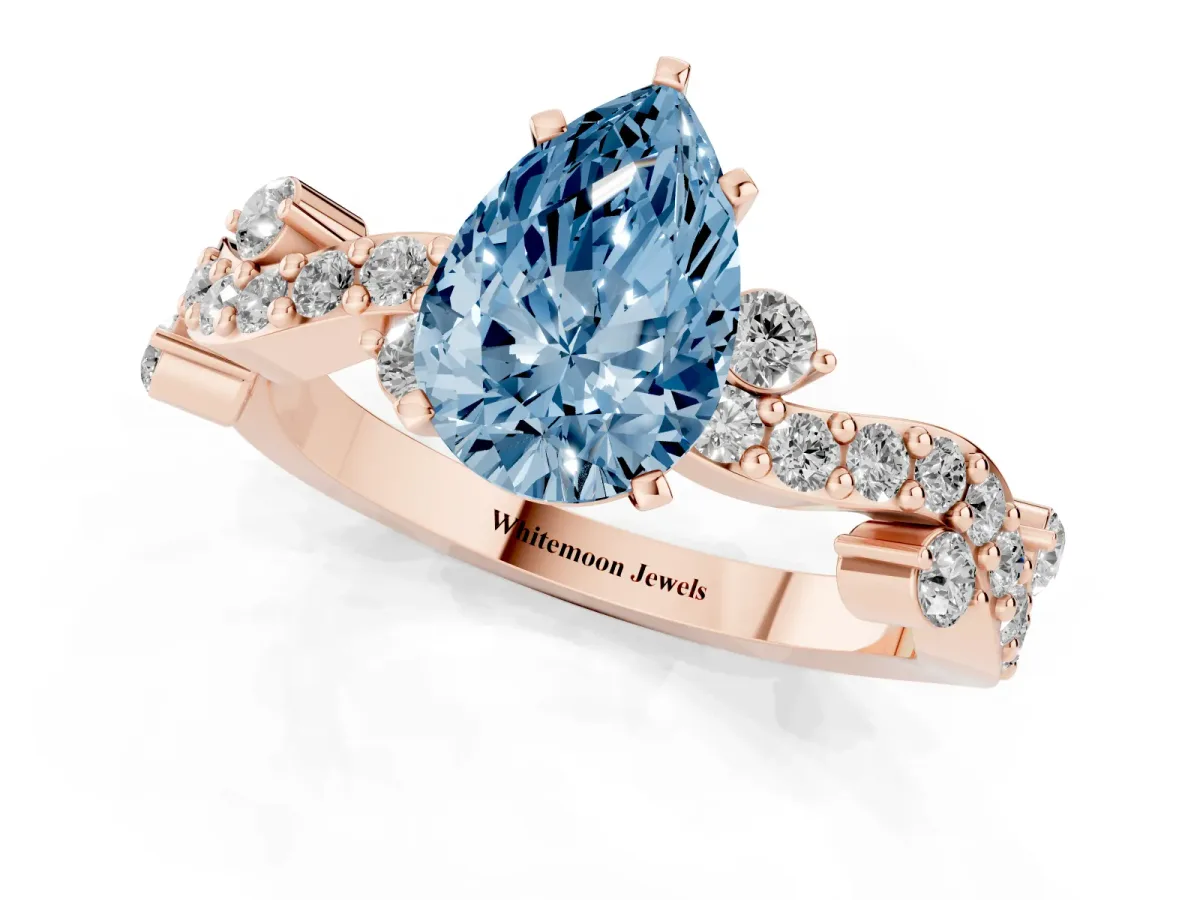 Fancy Blue Pear Cut Cut Solitaire Diamond Twisted Band with Pave Setting Rose gold