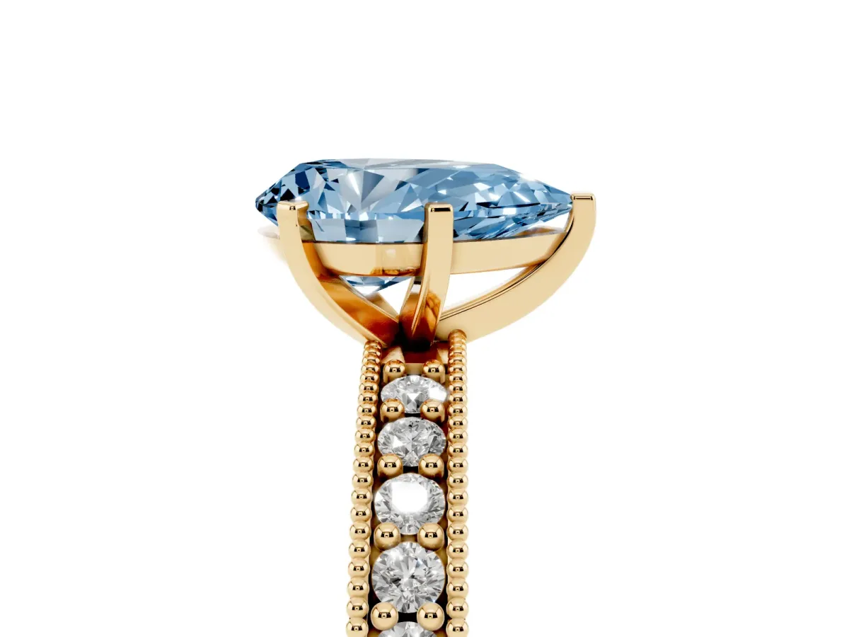 Fancy Blue Pear Cut Diamond Milgrain Pavé Engagement Ring with Four-Prong Setting Yellow gold