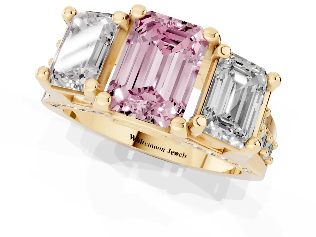 Fancy Pink Emerald Cut Diamond Three-Stone Ring with Channel Set Band and Four-Prong Setting Yellow gold