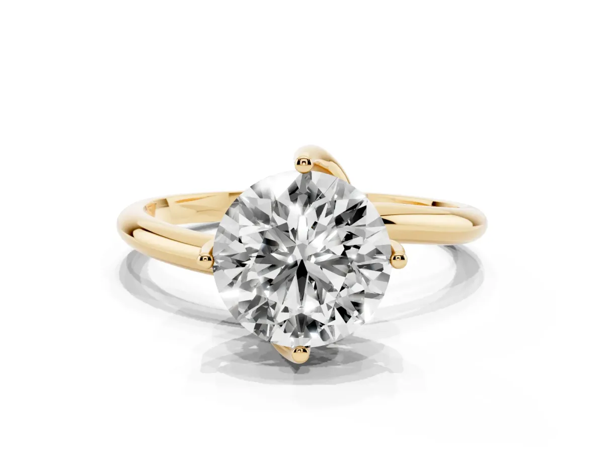Round Cut Diamond Solitaire Engagement Ring with Four-Prong Setting and Classic Band Yellow gold