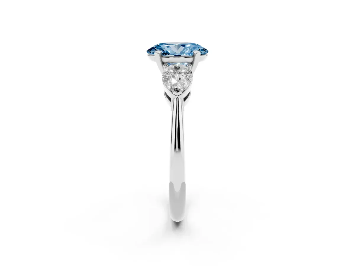 Fancy Blue Three-Stone Oval Cut Diamond Ring with Pear Side Stones and Four-Prong Setting Platinum