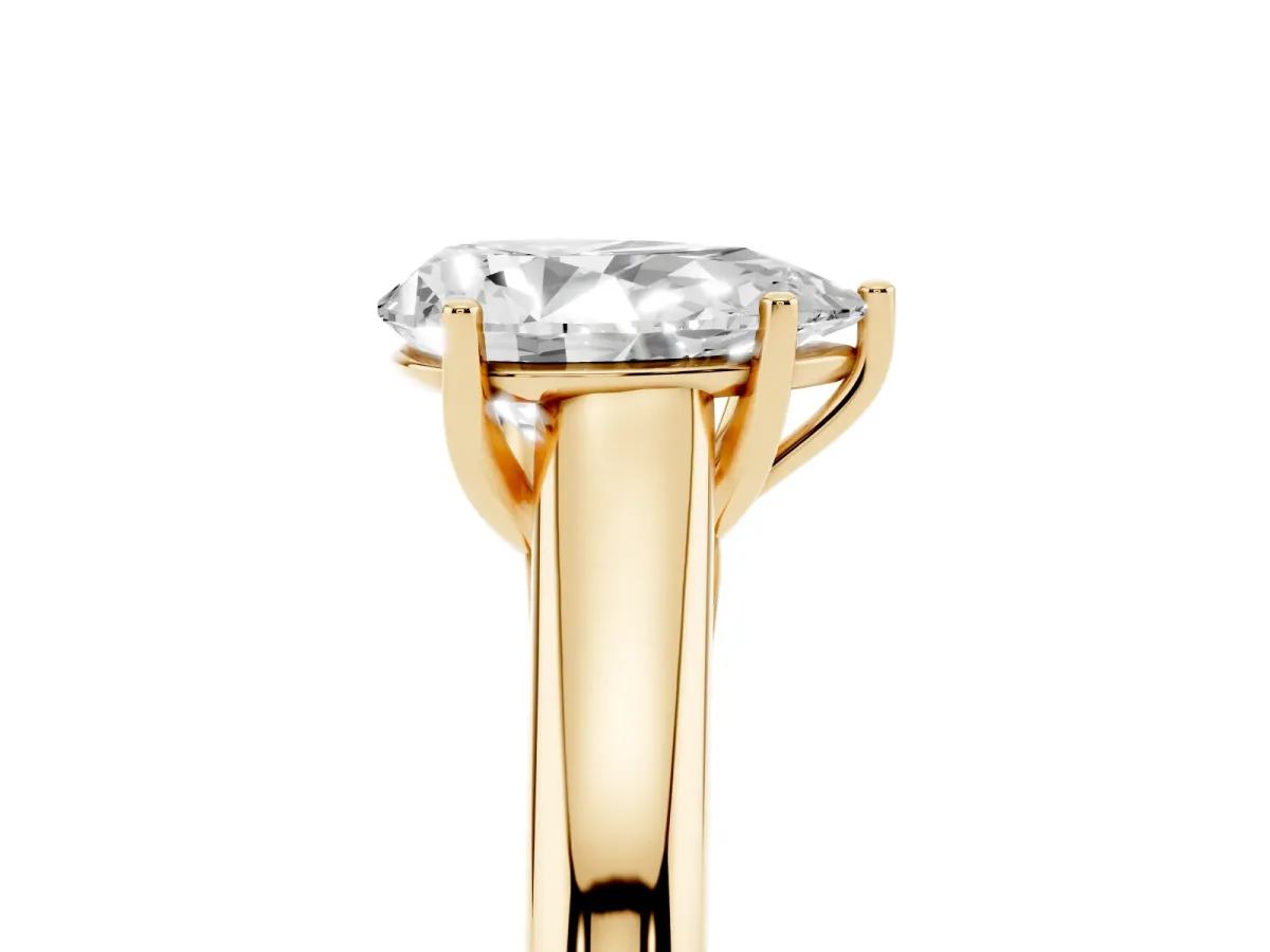 Pear Cut Solitaire Engagement Ring with Tapered Band and Four-Prong Setting Yellow gold