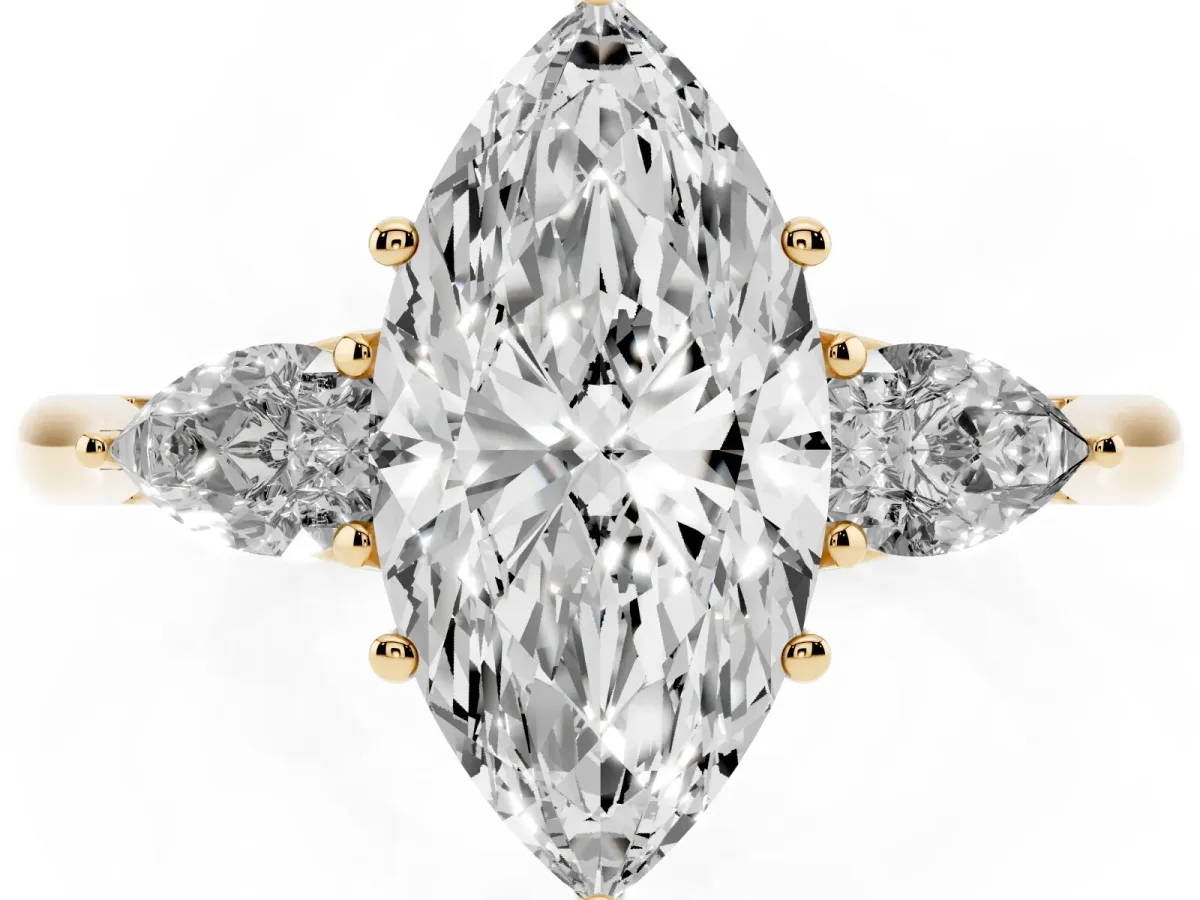 Three-Stone Marquise Cut Brilliant Diamond Solitaire Ring with Tapered Band and Four-Prong Setting Yellow gold