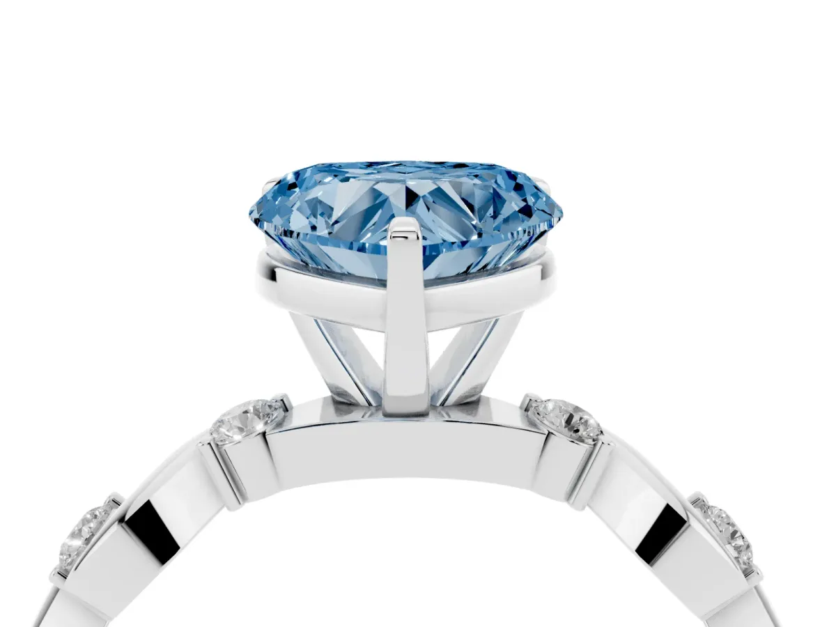 Fancy Blue Heart Cut Diamond Solitaire Twisted Band with Round Accents and Prong Setting Platinum