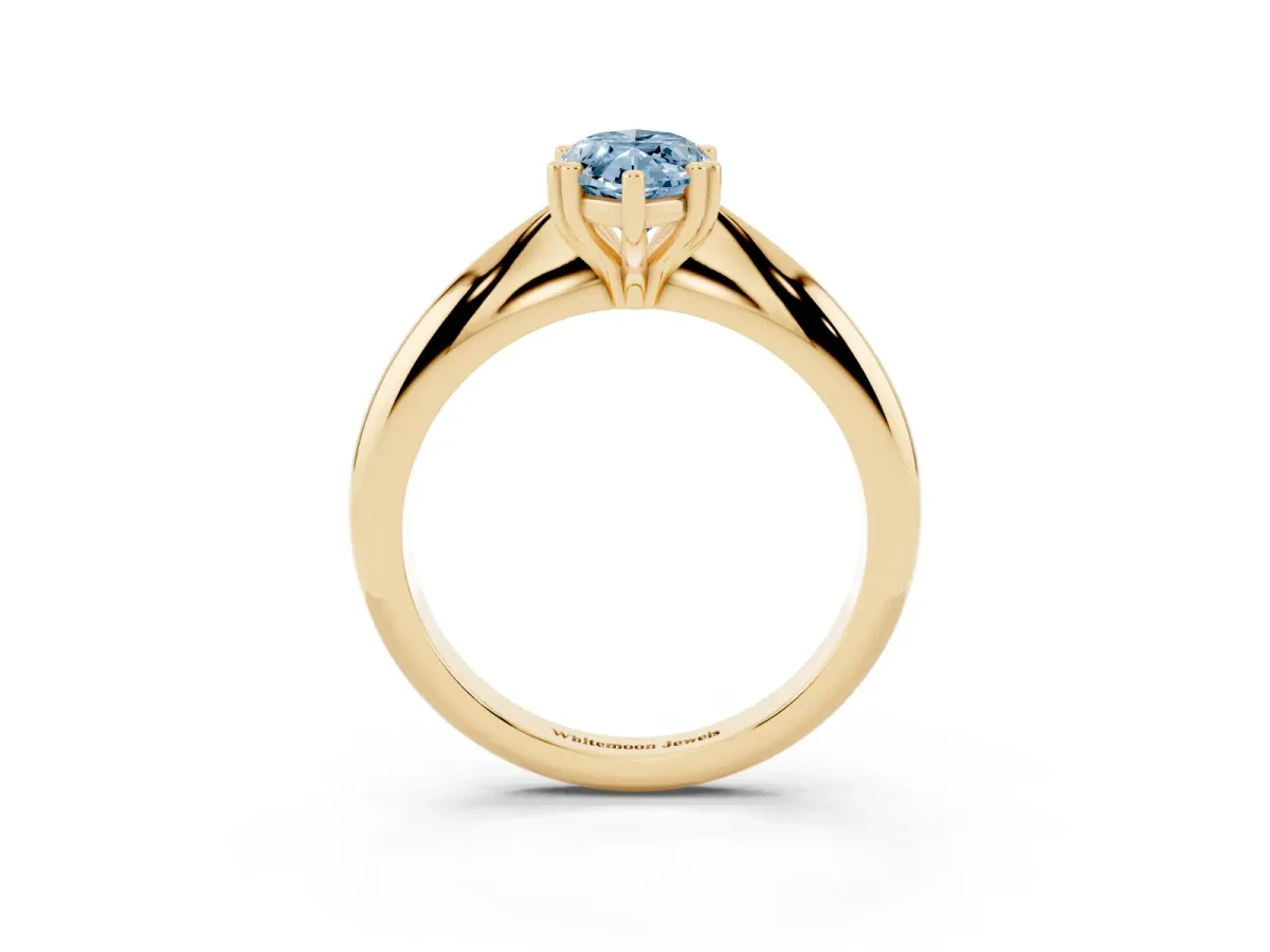 Fancy Blue Marquise Cut Cut Solitaire Engagement Ring with Tapered Band and Four-Prong Setting Yellow gold