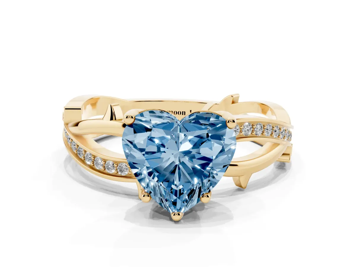 Fancy Blue Heart Cut Solitaire Twist Band with Pavé Accents and Four-Prong Setting Yellow gold