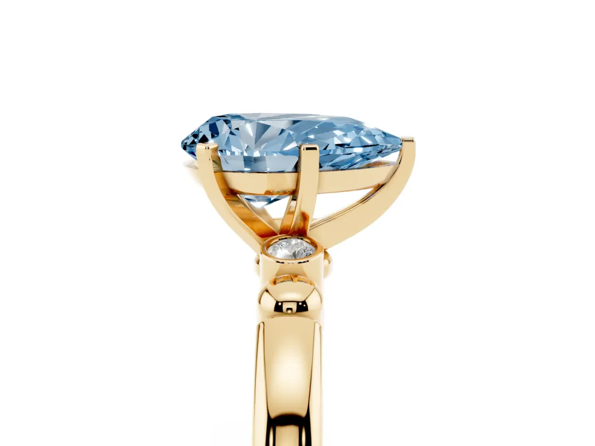 Fancy Blue Pear Cut Solitaire Beaded Band with Four-Prong Setting Yellow gold