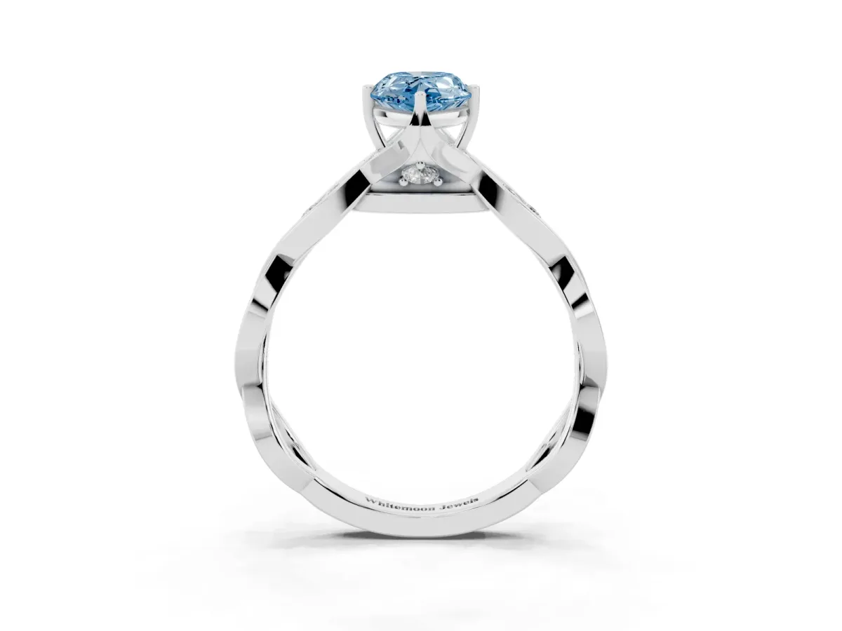 Fancy Blue Pear Cut Solitaire Twist Band with Leaf Prong Setting Silver