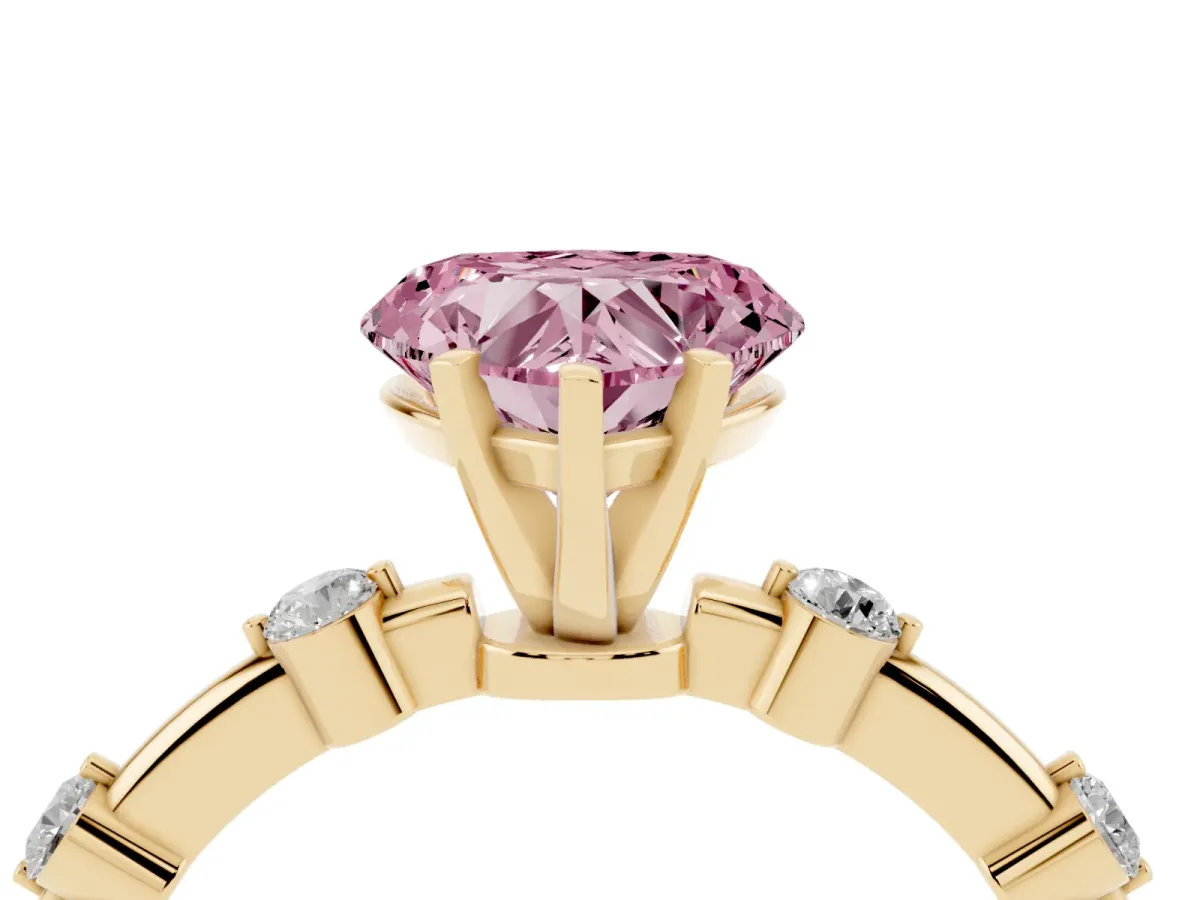 Fancy Pink Heart Cut Solitaire Diamond Ring with Bezel Set Side Stones and Prong Setting Yellow gold