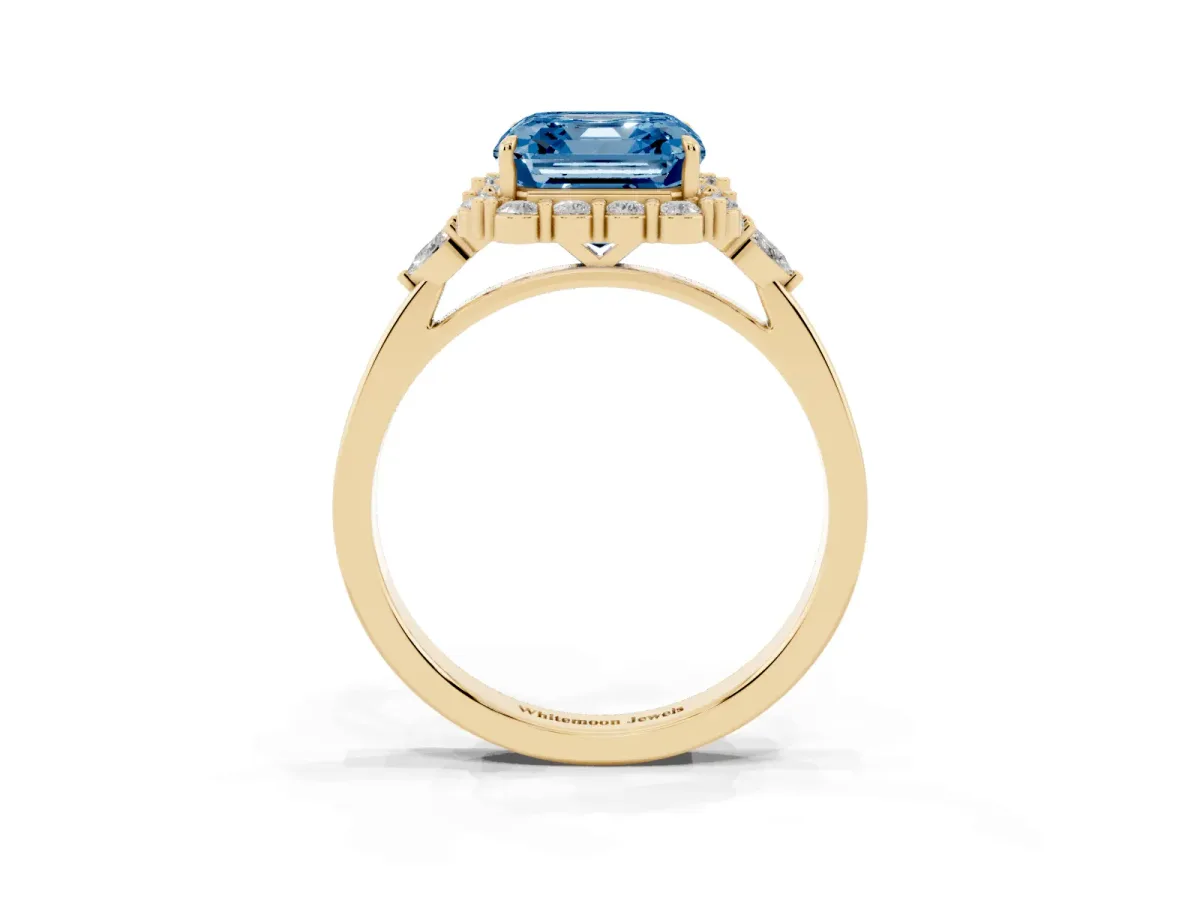 Fancy Blue Asscher Cut Diamond Halo Ring with Pear Side Stones and Prong Setting Yellow gold