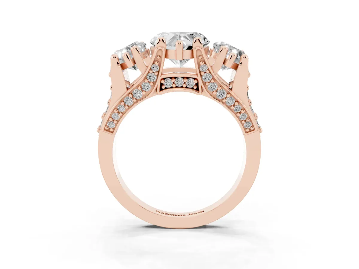 Heart Cut Diamond Three-Stone Ring with Channel Set Band and Four-Prong Setting Rose gold