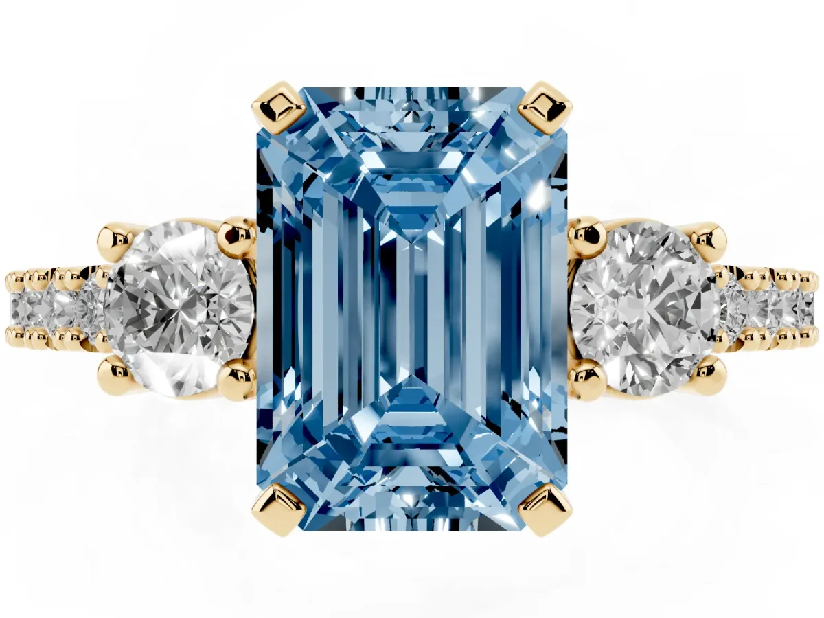 Fancy Blue Emerald Cut Three-Stone Diamond Pavé Band with Prong Setting Yellow gold