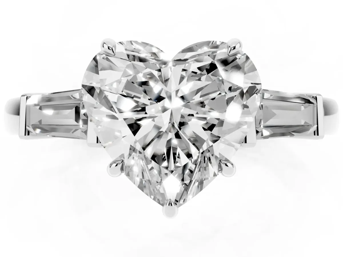 Heart Cut Diamond Three-Stone Ring with Tapered Baguette Side Stones and Prong Setting Platinum